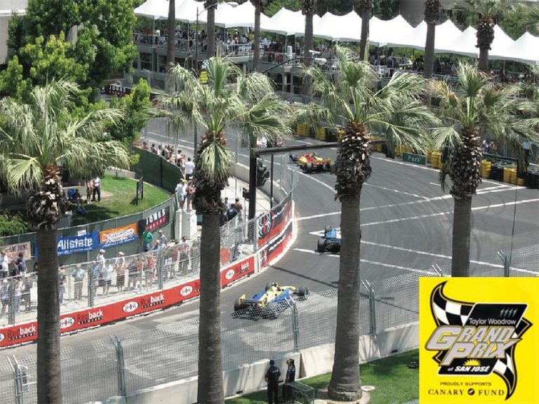 Champ cars racing through downtown San Jose streets during the Grand Prix