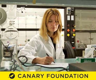 Canary Foundation researchers collaborating inside the lab