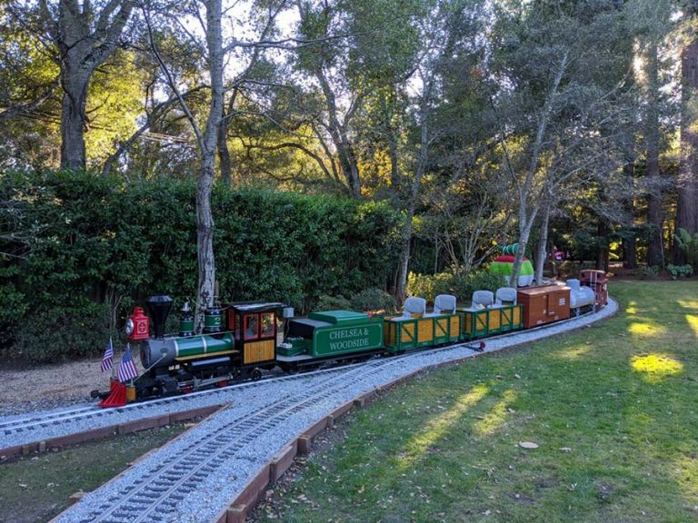 Chelsea & Woodside backyard railroad with Don Listwin driving the train